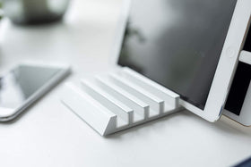 Close up view of white Phone and Tablet Stand holding tablet by Yamazaki Home. view 5