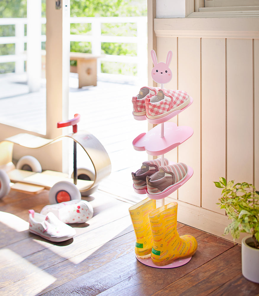 View 2 - Front view of pink Kids' Shoe Rack in entryway by Yamazaki Home.