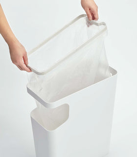 White Side Table Trash Can with plastic bag on white background by Yamazaki Home. view 5