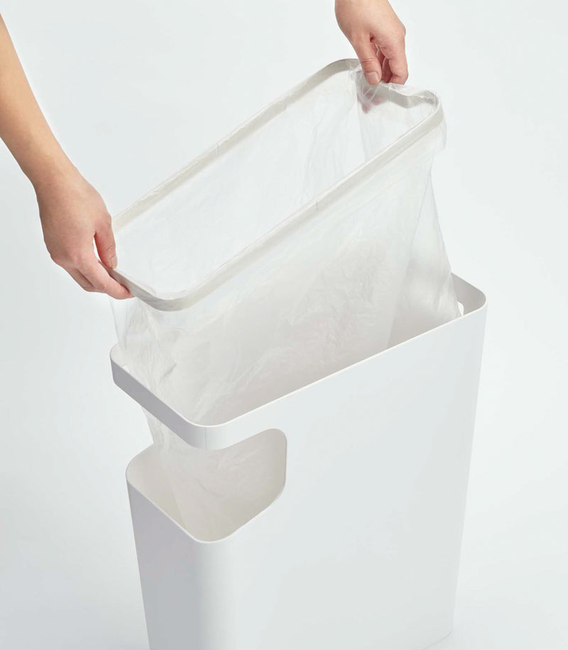 White Side Table Trash Can with plastic bag on white background by Yamazaki Home.