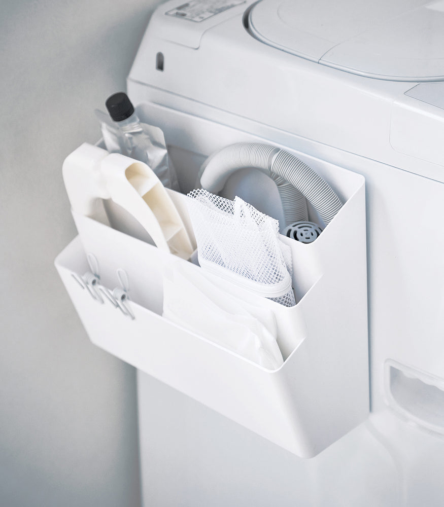View 3 - White Magnetic Storage Caddy containing cleaning items in laundry room by Yamazaki Home.