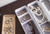 Close up of White Stacking Watch and Accessory Case opened with glasses and jewelry