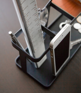 Close up aerial view of black Desk Organizer holding phone, pen, and ruler by Yamazaki Home. view 7