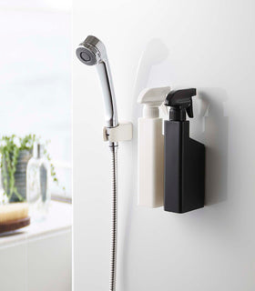 Black and white Magnetic Spray Bottles mounted on shower wall by Yamazaki Home. view 12
