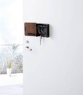 Black Square Magnetic Key Cabinet on closet door by Yamazaki Home. view 9