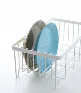 Side view of white Dish Rack holding two plates on white background by Yamazaki Home. view 5