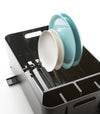 Black Dish Rack holding plates on white background by Yamazaki Home.