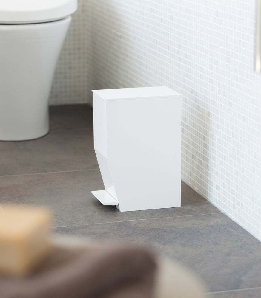 View 3 - Side view of white Step Trash Can in bathroom by Yamazaki Home.