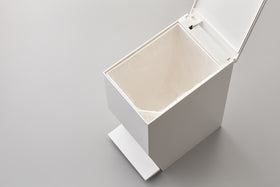 Aerial view of white Step Trash Can open containing plastic bag on white background by Yamazaki Home. view 7