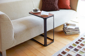 Black C Side Table holding book and coffee in living room by Yamazaki Home. view 5