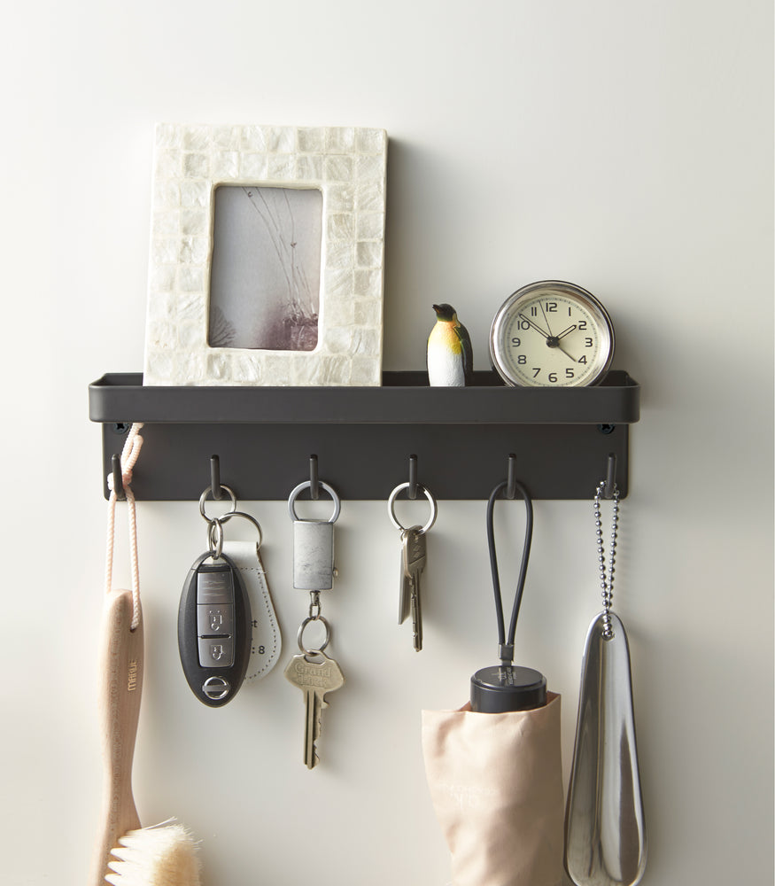 View 10 - Front view of black Magnetic Key Rack with Tray holding keys and items by Yamazaki Home.