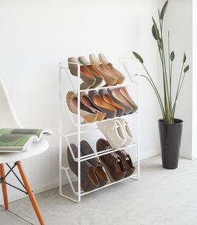 White Shoe Rack holding heels and sneakers by Yamazaki home. view 2
