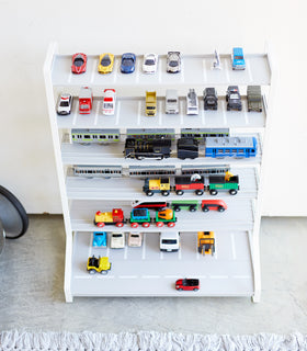 Aerial front view of white Kids' Parking Garage displaying toy trains and cars by Yamazaki Home. view 4