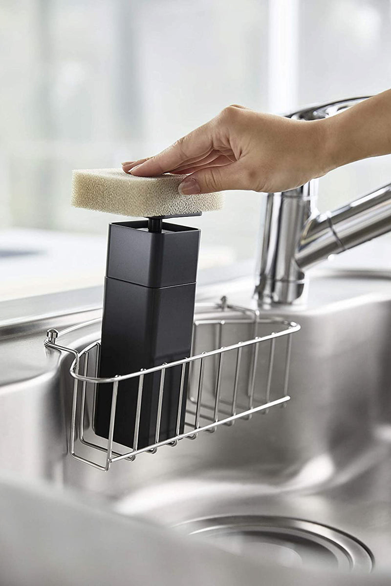 Black One-Handed Push Soap Dispenser in kitchen sink by Yamazaki Home.
