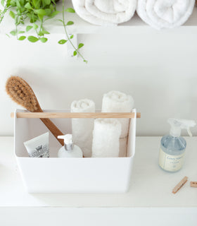 Aerial view of white Storage Caddy holding towels and bath items by Yamazaki Home. view 6