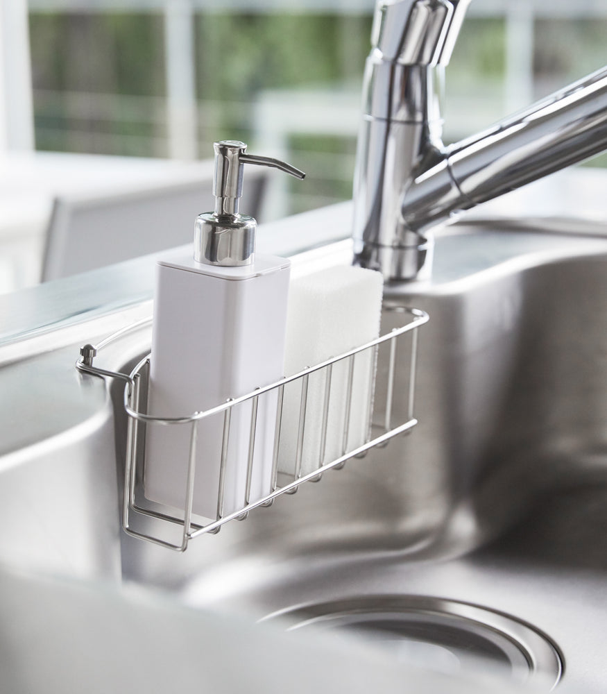 View 4 - White Hand Soap Dispenser in sink tray in kitchen sink by Yamazaki Home.