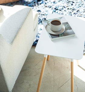 Aerial view of white Side Table holding coffee cup and book in living room by Yamazaki Home. view 5