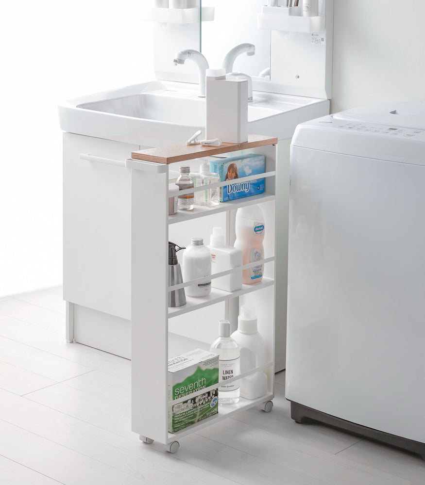 View 4 - White Rolling Storage Cart holding cleaning supplies in laundry room by Yamazaki Home.