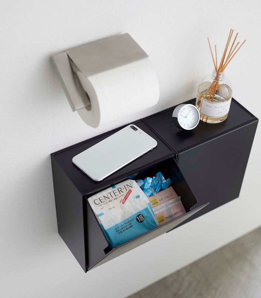 View 13 - Aerial view of two black Wall-Mount Storage bins open in bathroom by Yamazaki Home.