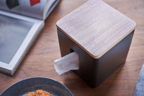 Aerial view of black toilet paper holder on tabletop by Yamazaki Home. view 10