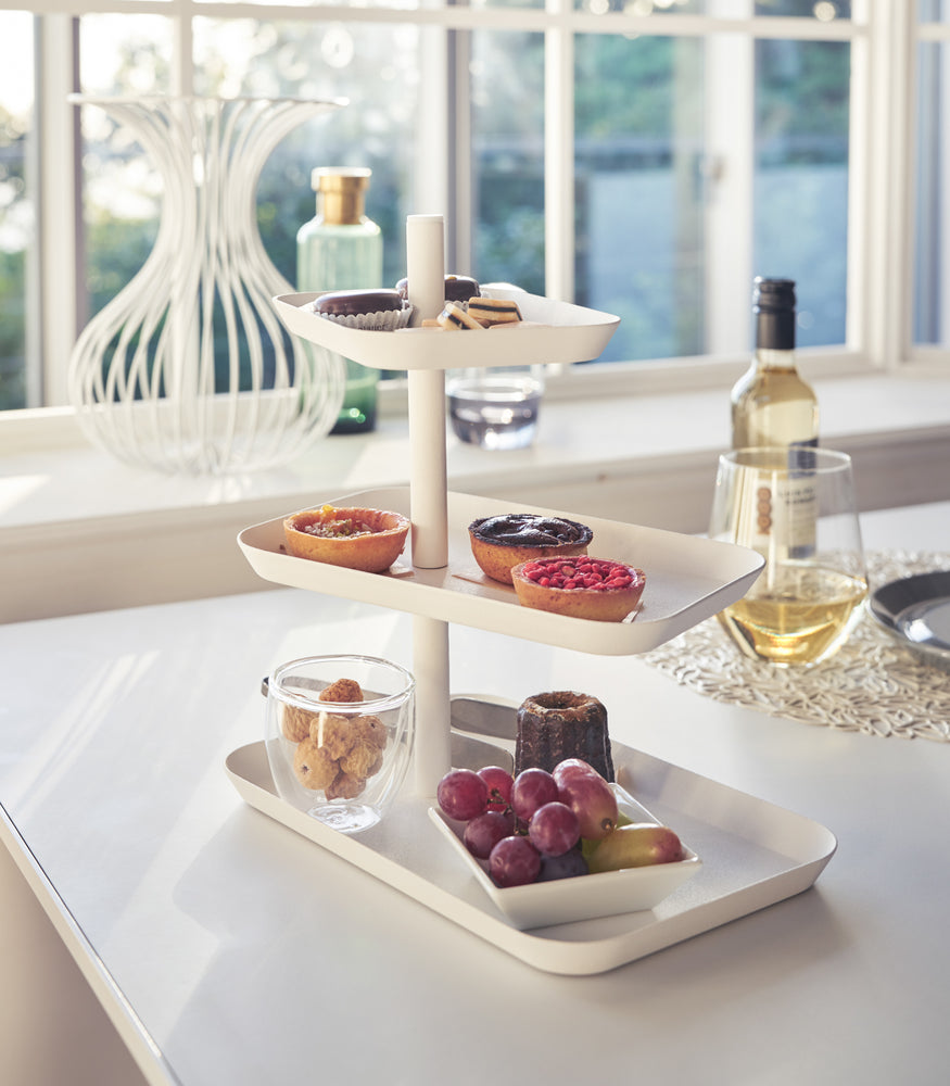 View 3 - White Serving Stand displaying desserts on table by Yamazaki Home.