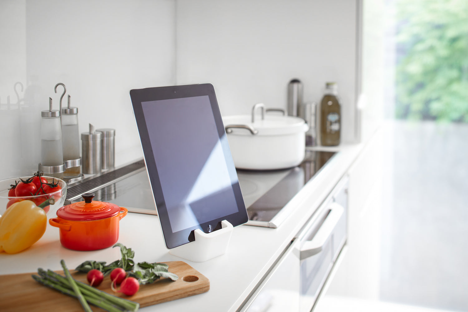 View 3 - Side view of white Tablet Stand holding tablet in kitchen by Yamazaki Home.