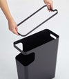 Black Side Table Trash Can on white background by Yamazaki Home.