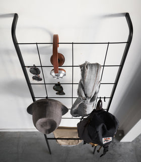 Aerial view of black Leaning Ladder with Grid Panel displaying clothing and accessories by Yamazaki Home. view 12