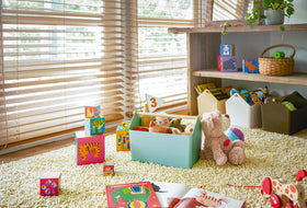 Blue Storage Caddy holding toys in playroom by Yamazaki Home. view 12