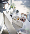 Open white Makeup Organizer holding makeup by Yamazaki Home.