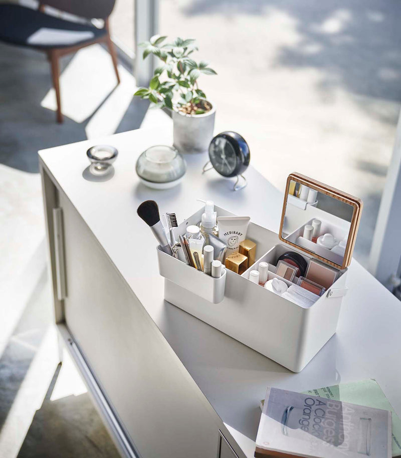 Open white Makeup Organizer holding makeup by Yamazaki Home.