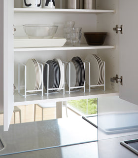White Dish Storage Rack displaying plates in kitchen cabinet by Yamazaki Home. view 3
