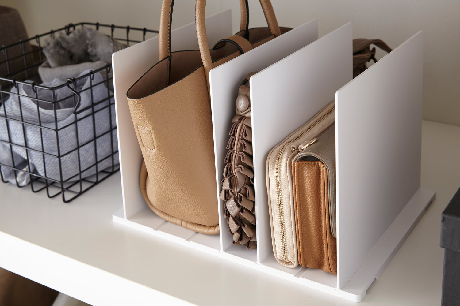 View 3 - White Bag Organizer with Customizable Dividers displaying purses in closet by Yamazaki Home.