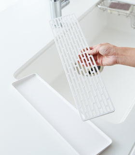 White Sink Drainer Tray with removed top layer on kitchen sink by Yamazaki Home. view 5