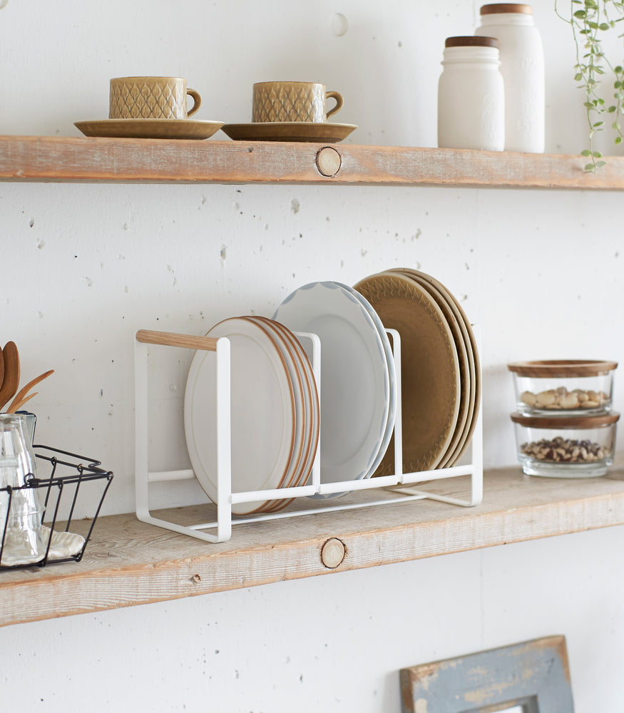 View 3 - Wood-Accented Dish Storage Rack holding plates on kitchen shelf by Yamazaki Home.