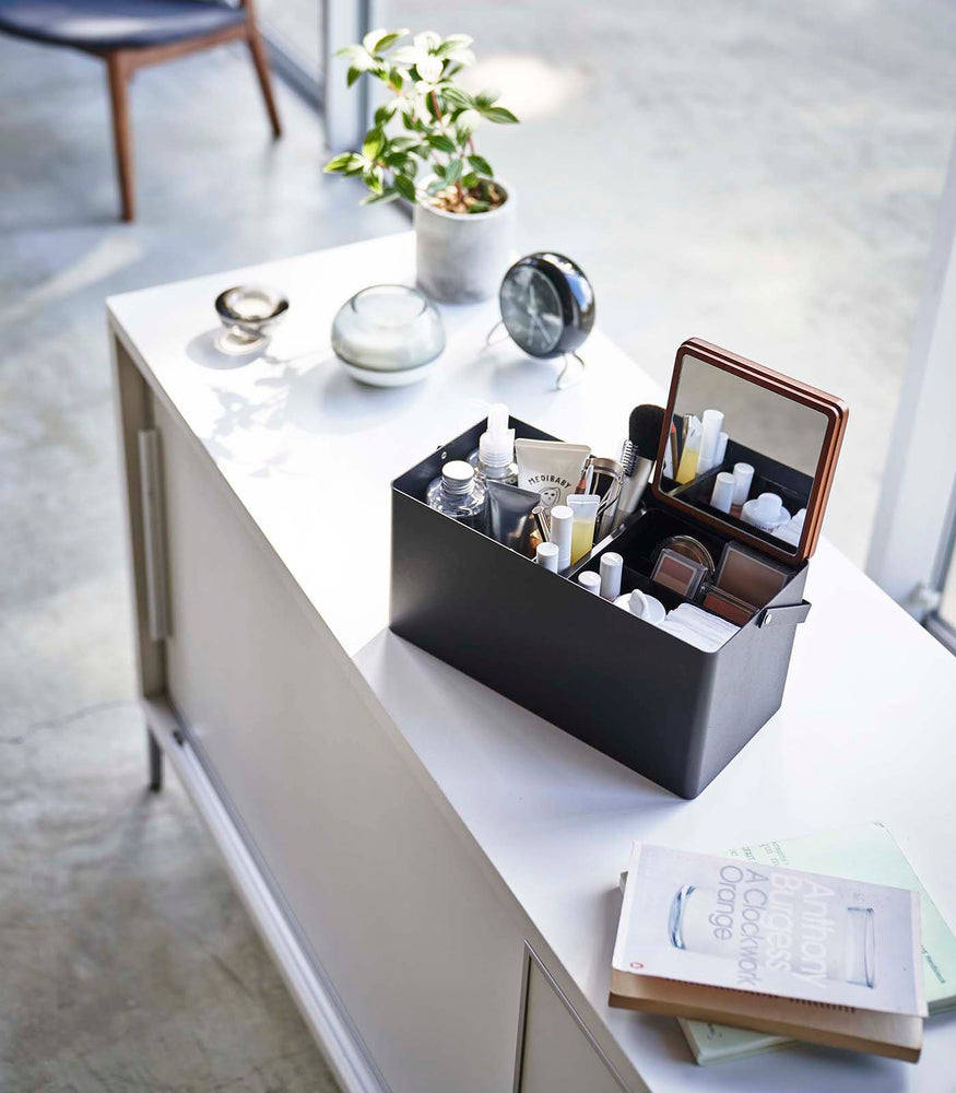 View 10 - Black Makeup Organizer holding makeup products on table by Yamazaki Home.