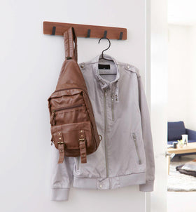 Over-the-Door Hanger holding bag and jacket by Yamazaki Home. view 7
