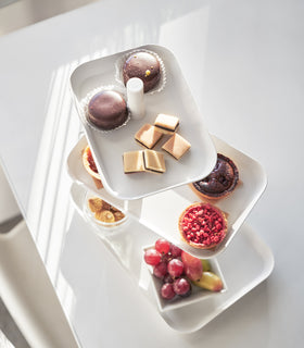 Aerial view of white Serving Stand displaying desserst on white tabletop by Yamazaki Home. view 4