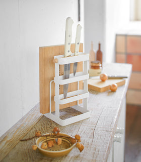 White Knife & Cutting Board Stand holding knifes and board on shelf by Yamazaki Home. view 3
