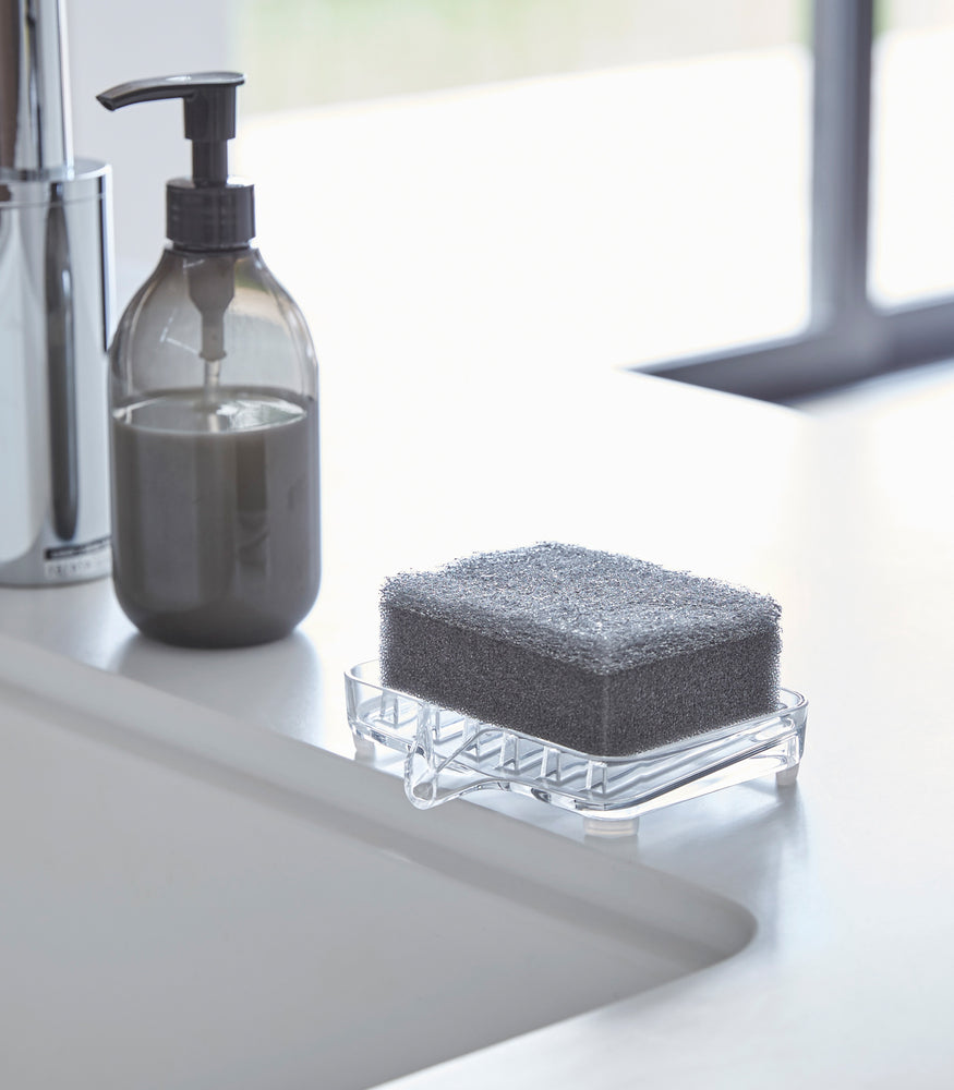View 2 - Self Draining Soap Tray on holding sponge on sink counter by Yamazaki Home.