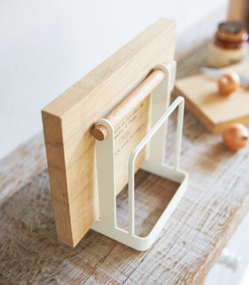 Aerial view of Knife & Cutting Board Stand holding cutting board on shelf by Yamazaki Home. view 3