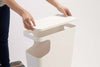 White Side Table Trash Can with lid removed on white background by Yamazaki Home.