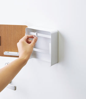 Close up of open white Square Magnetic Key Cabinet with hooks by Yamazaki Home. view 6