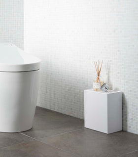 White Wall-Mount Storage on floor in bathroom by Yamazaki Home. view 4