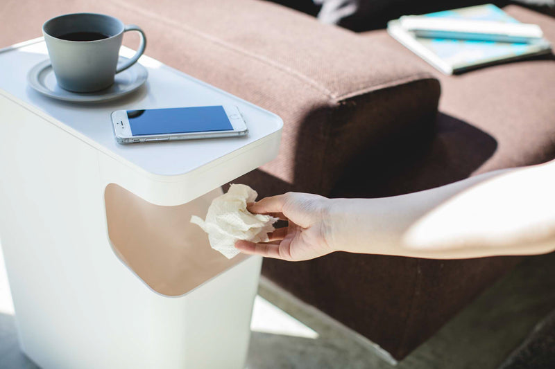White Side Table Trash Can displaying cup and phone in living room by Yamazaki Home.