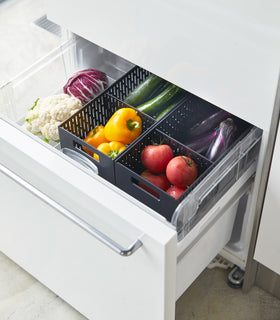 Aerial view of black Stackable Vegetables Stocker containing food in kitchen fridge by Yamazaki Home. view 12