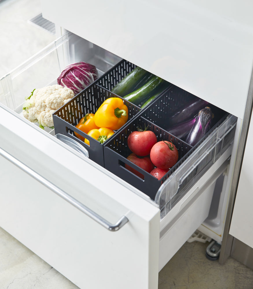 View 12 - Aerial view of black Stackable Vegetables Stocker containing food in kitchen fridge by Yamazaki Home.