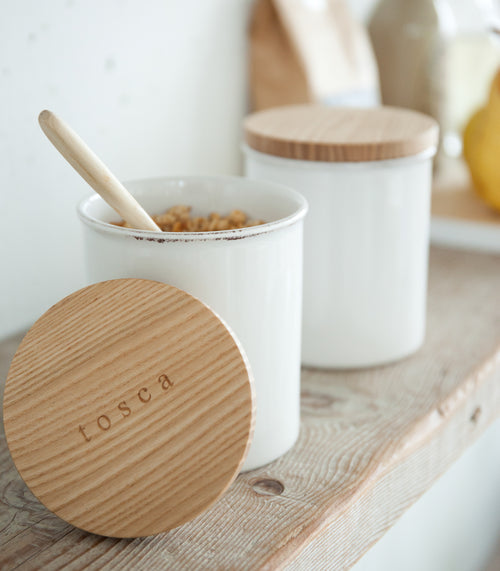 Close up view of Ceramic Food Canister holding food on shelf by Yamazaki Home.