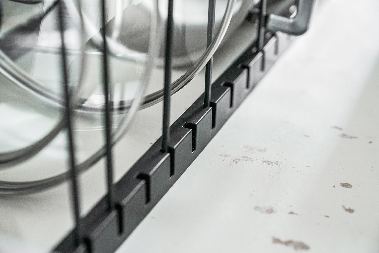 View 16 - Close up of white Slim Dish Rack holding silverware by Yamazaki Home.