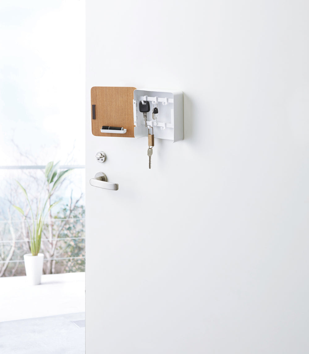 White Square Magnetic Key Cabinet containing keys on door by Yamazaki Home.